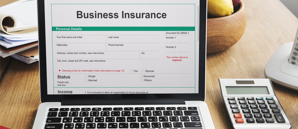 Laptop with information about business insurance