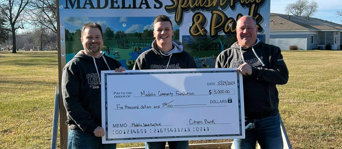 Scott, Andrew and Mark with a check for $5,000 for the Madelia splash pad and park