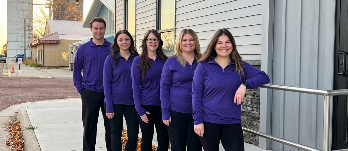 Ormsby staff standing outside the bank building